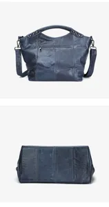 Detail shot of dark blue leather crossbody bag, showing metal studs and zipper pocket structure.