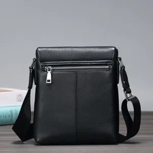 Detailed view of the black genuine leather men's messenger bag, showcasing fine grain and zipper.