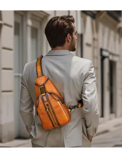 Detailed view of retro leather chest bag worn by man outdoors. Premium cowhide sling bag detail.