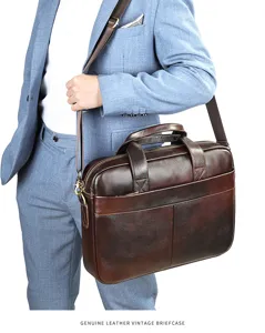 Close-up detail of men's vintage genuine leather business briefcase with adjustable strap.