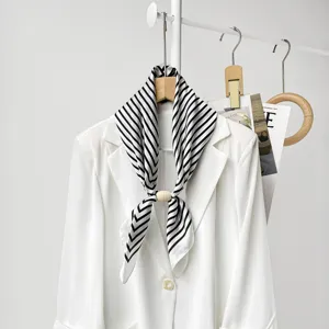 Elegant black and white striped silk scarf with wooden magnetic buckle, perfect women accessory.