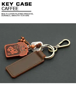 Vintage genuine leather car keychain with wooden pendant and durable metal hardware for keys.