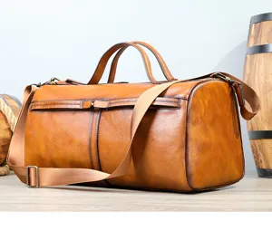 Vintage genuine leather duffel bag for travel, premium cowhide gym shoulder bag with strap.