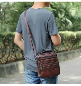 Men's genuine leather shoulder bag, multi-pocket business casual vertical messenger bag.