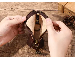 Pochette à clés vintage en cuir avec fermeture éclair, petit porte-monnaie marron pour hommes.
