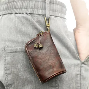 Étui à clés en cuir vintage pour homme, pochette rétro marron avec crochet en métal et fermeture éclair.