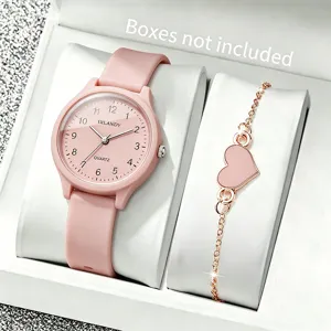 Detailansicht einer rosa Silikonuhr und eines herzförmigen Armbands in Weißbox