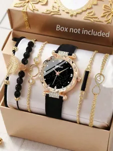 Detailansicht der Luxusuhr mit Strasssteinen und goldfarbenem Armbandset mit Zifferblatt