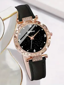 Nahaufnahme einer luxuriösen Damenuhr mit sternenschwarzem Zifferblatt und Strass