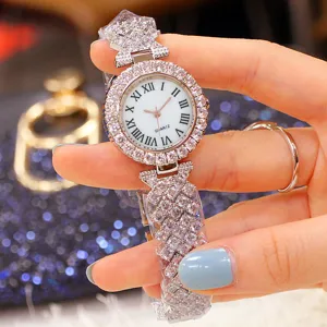 Close-up view of an elegant silver women's quartz watch encrusted with sparkling rhinestones