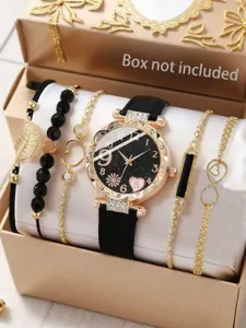 Nahaufnahme einer Damen-Sternenhimmel-Uhr mit Diamant-Zifferblatt und Gold-Armband-Set