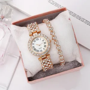 Elegant gold-tone ladies watch and rhinestone bracelet set in a pink gift box