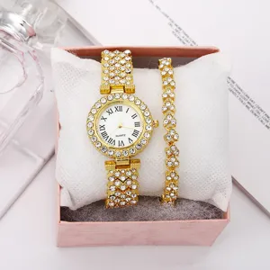 Close-up of elegant gold rhinestone quartz watch and butterfly bracelet gift set