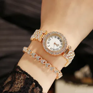 Close-up of elegant women's gold rhinestone quartz watch and matching heart bracelet set