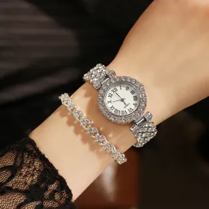 Close-up of elegant silver quartz watch and matching crystal bracelet on wrist