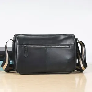 Black genuine leather men's shoulder bag with striped strap, detailed zipper pocket and soft texture.