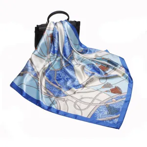 Elegant blue and white silk scarf with classic equestrian strap and tassel print for women.