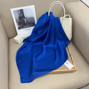 Solid color blue square silk scarf for women, elegant satin neckerchief for professional wear.