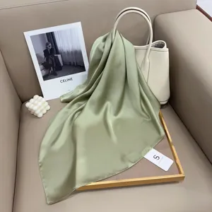 Solid color green silk square scarf, elegant minimalist design for women's daily wear.