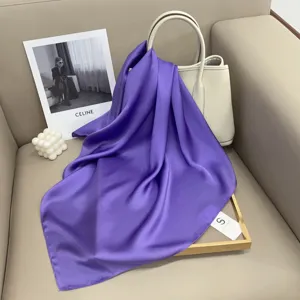 Solid color purple silk square scarf detail, elegant glossy fabric design for women style.