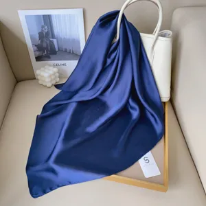 Solid color dark blue small square silk scarf for women, minimalist fashion accessory.
