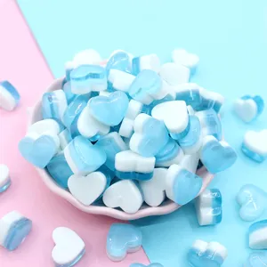Macro view of blue and white gradient heart-shaped resin charms for DIY slime and craft jewelry