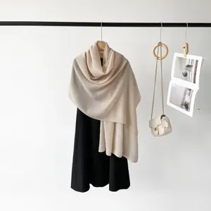 Beige pleated imitation silk scarf shawl for women with elegant drape on display.