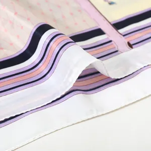 Close-up detail of women's 90cm satin silk square scarf with colorful stripes and lattice print.