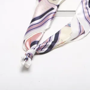 Detailed view of women's silk satin square scarf with elegant stripe print, ideal for spring.
