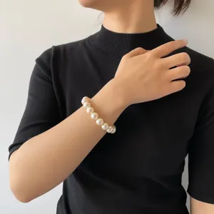 Elegant pearl bracelet detail showing lustrous beads and smooth texture on wrist wear.