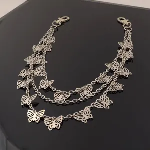 Silver multi-layer butterfly waist chain detail, punk grunge metal pants chain accessory.
