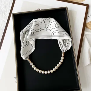 Pearl magnetic clasp silk scarf necklace detail view, stylish abstract pattern small necktie