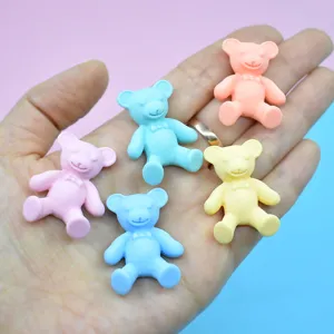 Detailed view of colorful matte resin teddy bear charms for DIY phone case decor