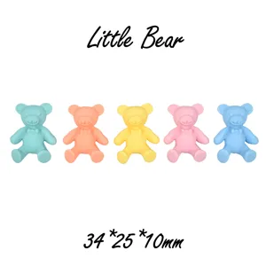 Macro view of matte resin bear DIY accessories in five vibrant colors and size details