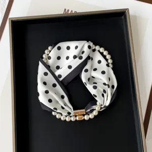 Chic black and white polka dot silk scarf with elegant pearl magnetic clasp necklace.