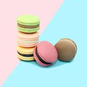 Close-up macro view of assorted colorful 3D resin macaroon DIY craft accessories