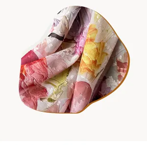 Detailed view of 90cm floral print satin square scarf, showing fabric texture and bright colors.
