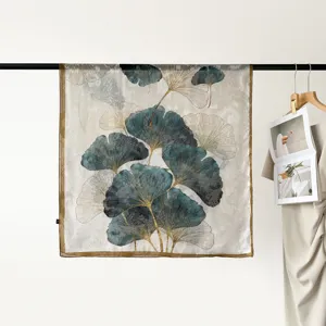 Elegant blue and gold ginkgo leaf printed large square silk scarf for women fashion wear.