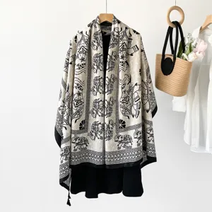Ethnic style elephant print shawl detail, featuring classic black and white patterns.