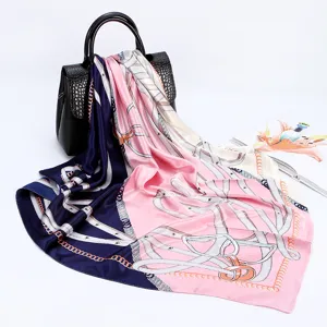 Elegant 90cm satin silk scarf with chic chain and belt print, draped gracefully detail.