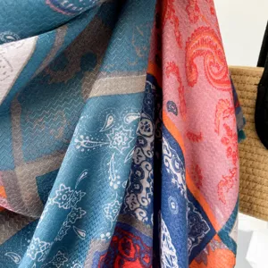 Close-up detail of ethnic paisley print cotton linen scarf, colorful shawl for women travel.