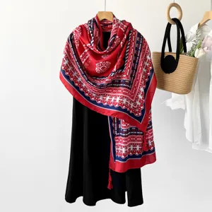 Ethnic style paisley print women shawl scarf, vibrant red and blue design for outdoor sun protection.