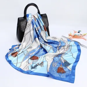 Blue white silk satin scarf detail, elegant chain and tassel print, perfect accessory for chic look.