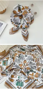 Elegant printed silk square scarf with classic bag motif for women spring and autumn fashion styling.