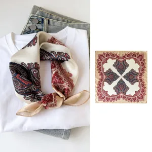 Detailed view of silk square scarf featuring traditional paisley print and elegant design.