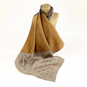 Elegant silk square scarf featuring geometric diamond pattern and chic dual-tone design.