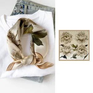 Detailed view of the vintage floral silk square scarf elegantly styled on white tee.