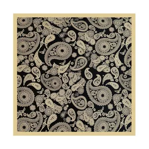 Detailed view of the luxury silk scarf featuring an intricate classic paisley pattern design.