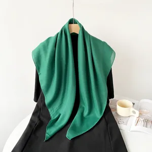 Solid green cotton linen square scarf detail showcasing fabric texture and elegant drape.