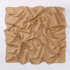 Detailed view of a solid khaki square scarf, showing smooth draped texture and fine fabric.